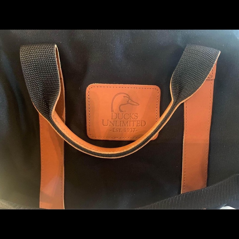 Ducks Unlimited NEW black canvas and leather duffel bag.